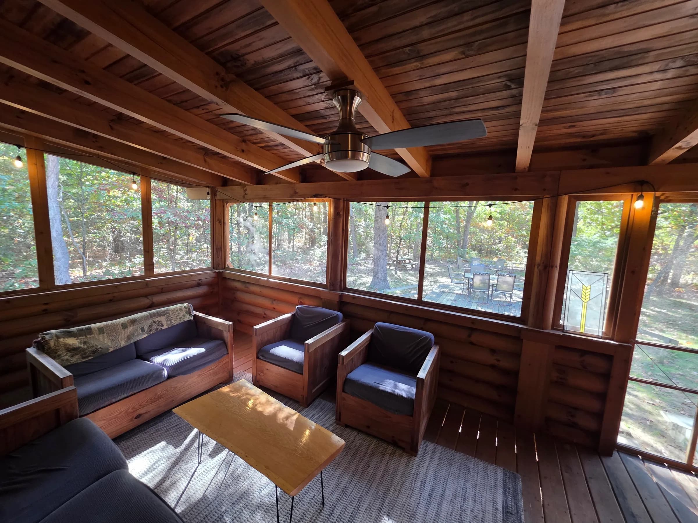 Screened porch surrounded by woods