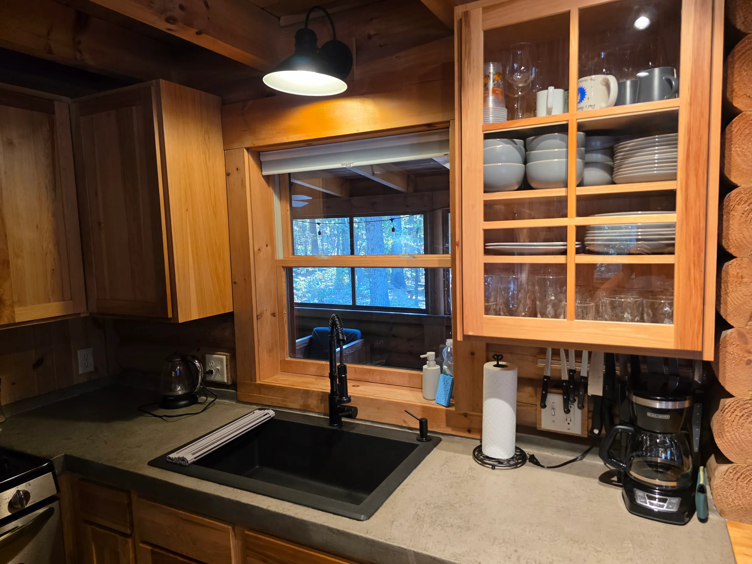 Kitchen sink with a view of the woods