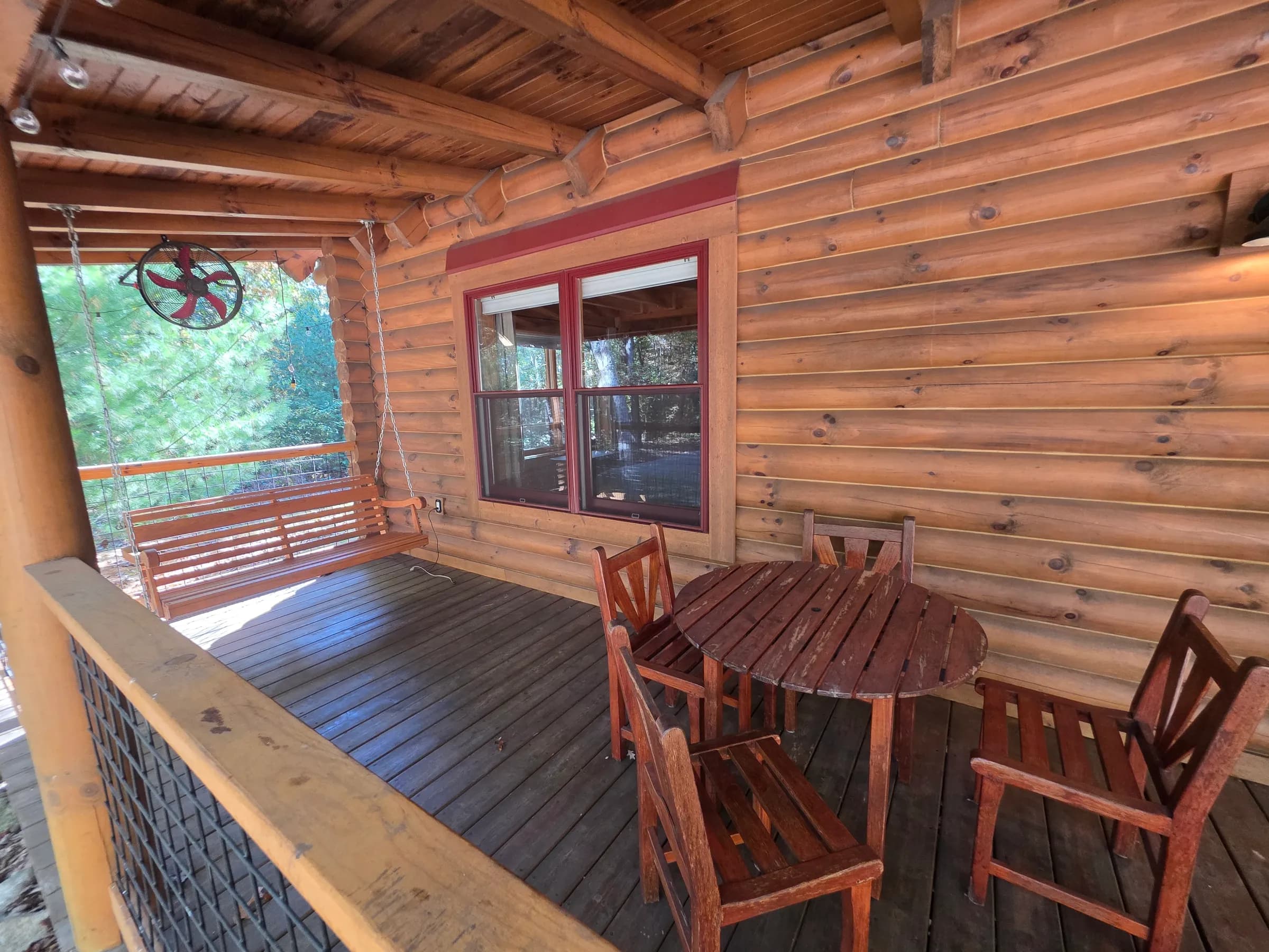 Porch dining with a view of the trees