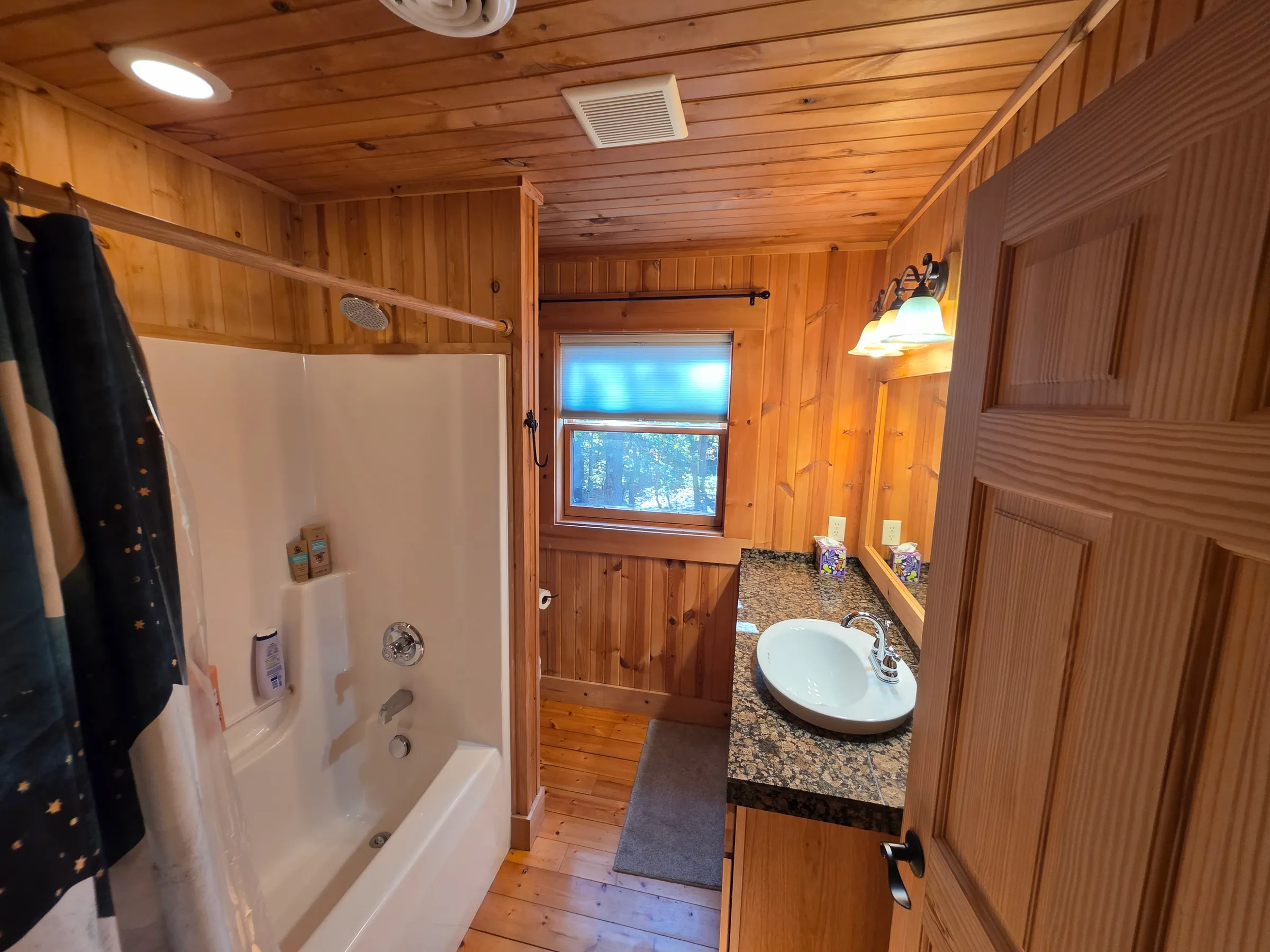 Full bathroom with tub and shower